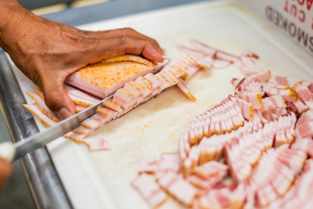 Slicing fresh bacon